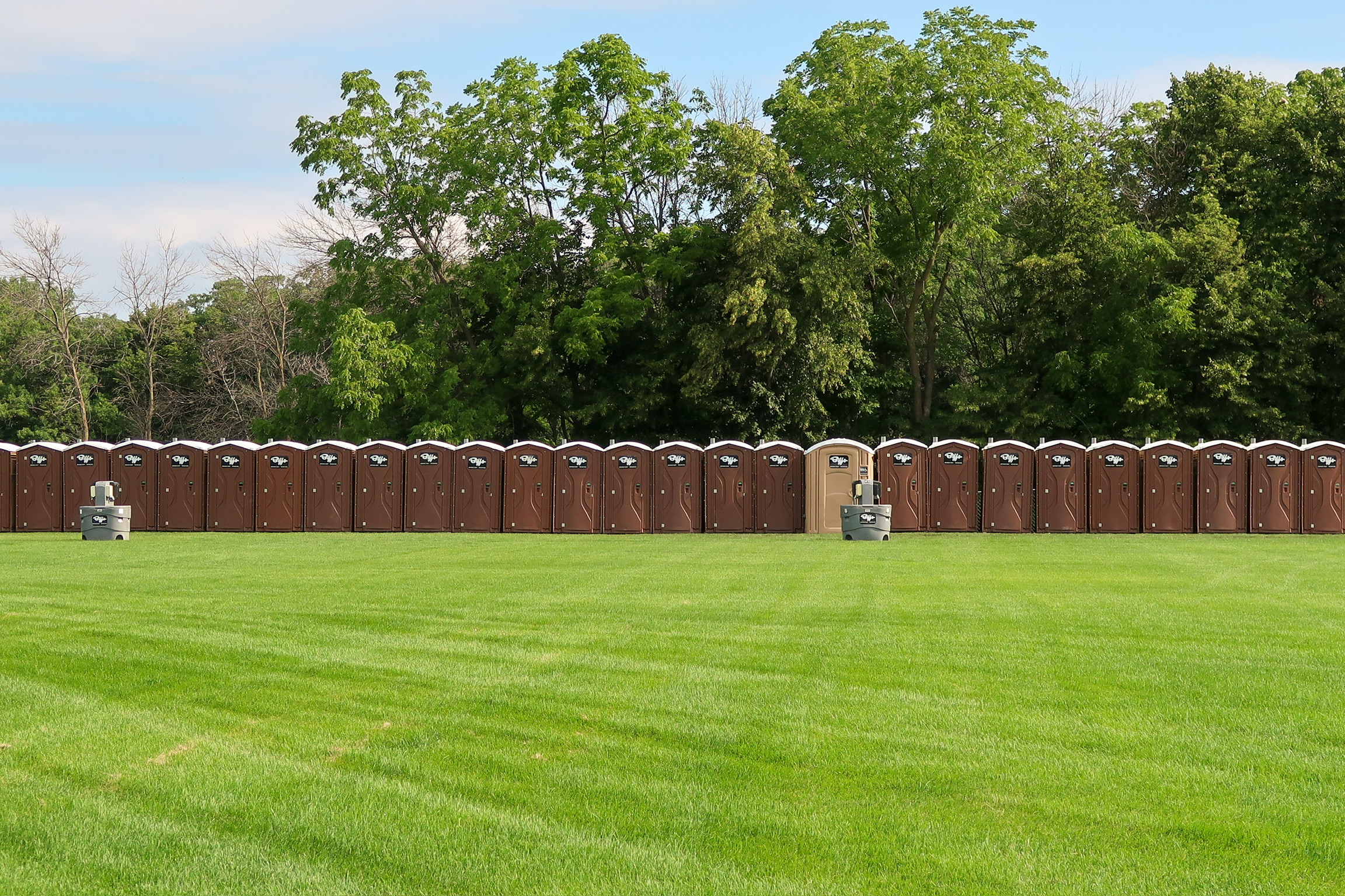 Biffs portable toilets and handwashing stations at an outdoor music event in Minnesota